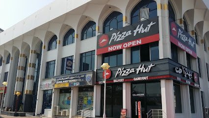 Pizza Hut on the Al Sarooj Complex Near Shell Filling Station street 